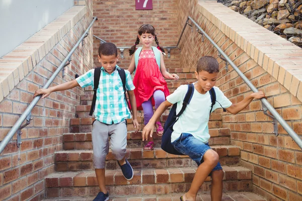 Kids going down the stairs — Stock Photo, Image