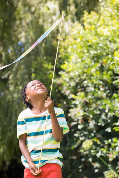 A kid is playing with a stick — Stock Photo, Image