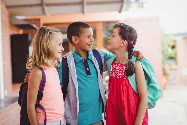 Three kids with arms around each other — Stock Photo, Image