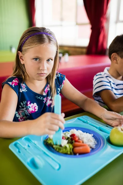 Child eating at the canteen — Stock Photo, Image