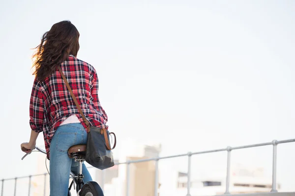 Hipster riding a bike — Stock Photo, Image