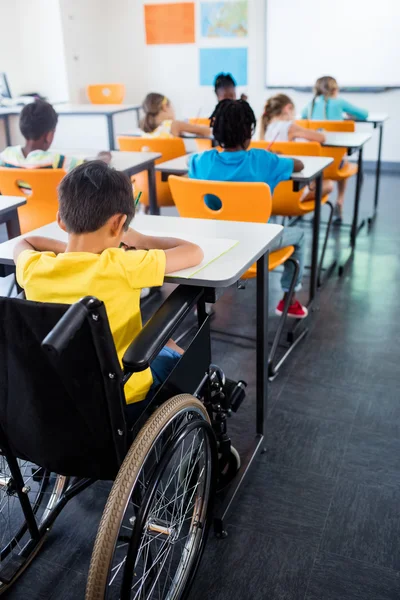 Pupils studying in class — Stock Photo, Image