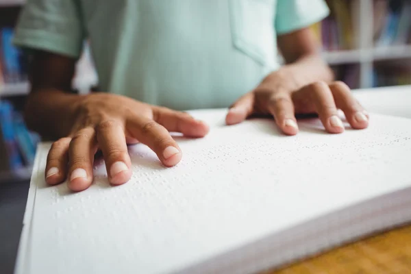 Boy using braille to read — Stock Photo, Image