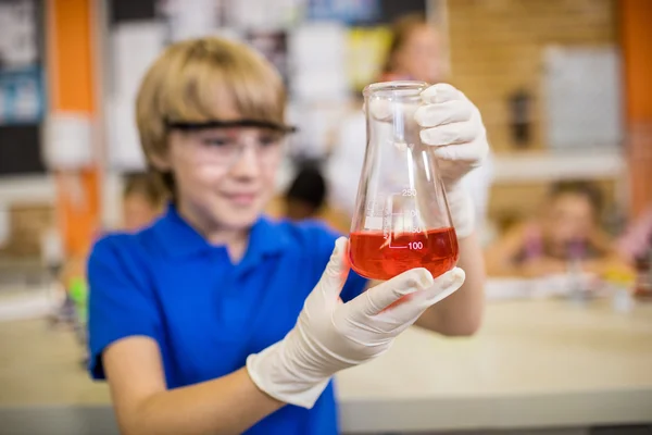 Child posing with a chemical liquid — Stock Photo, Image