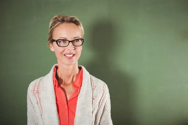 Teacher standing in front of blackboard — Stock Photo, Image