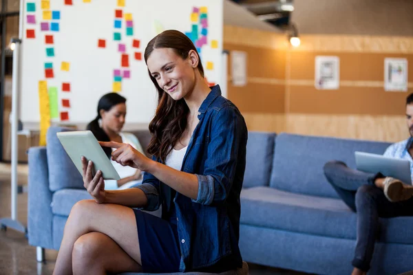 Woman using digital tablet with colleagues — Stock Photo, Image