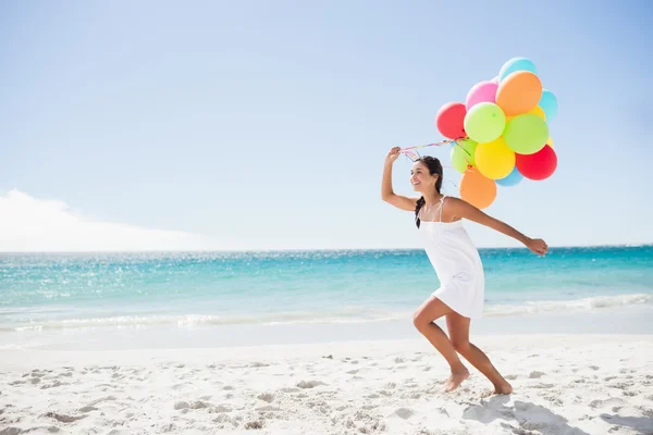 Beautiful woman holding balloon — Stock Photo, Image