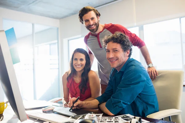 Colleagues using a graphic pad — Stock Photo, Image