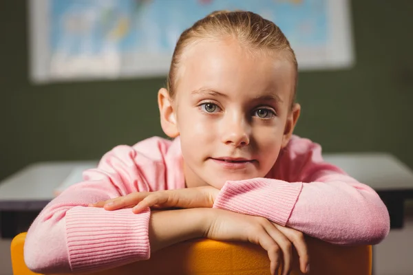 Girl leaning against chair — Stock Photo, Image