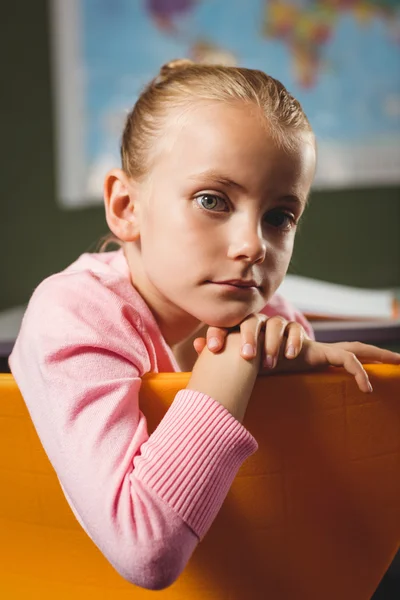 Girl leaning against chair — Stock Photo, Image