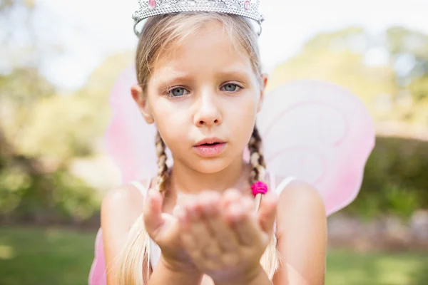 Portrait of cute girl pretending to be a fairy blowing kiss — Stock Photo, Image