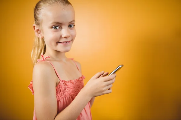 Girl using a smartphone — Stock Photo, Image