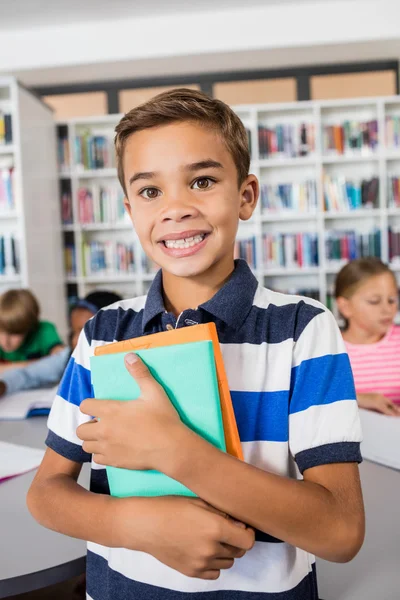 Little boy standing with notebooks — Stock Photo, Image