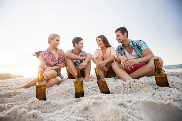 Smiling friends sitting — Stock Photo, Image