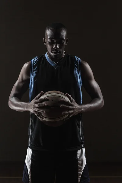 Portrait of basketball player holding a ball — Stock Photo, Image