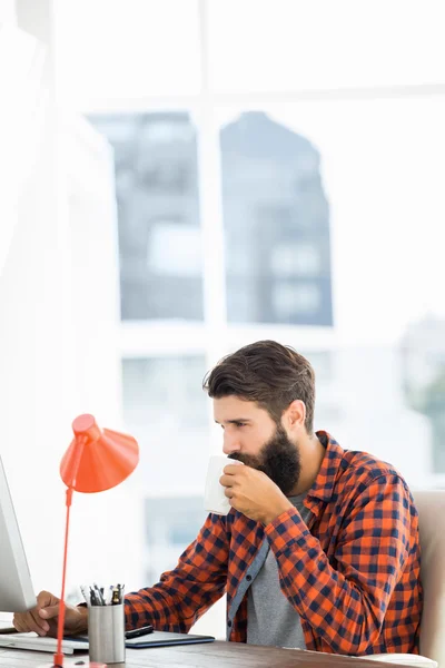 Handsome hipster working on computer — Stock Photo, Image