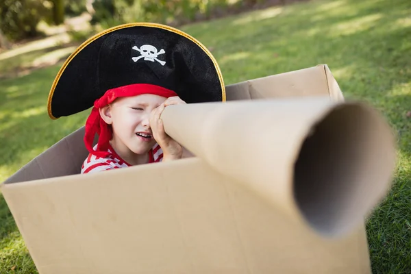 Portrait of a boy with pirate dress playing with cardboard spygl — Stock Photo, Image