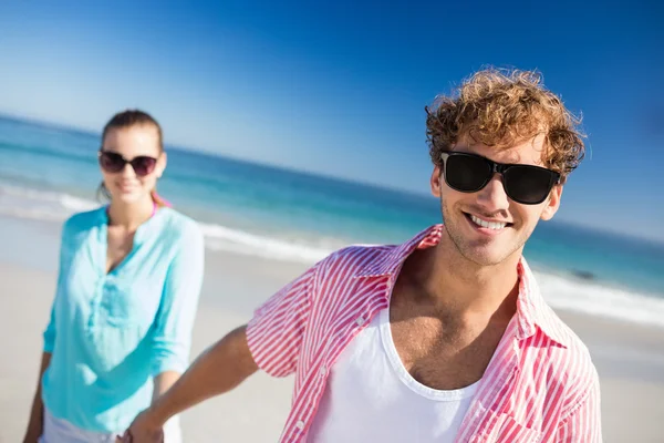 Happy couple posing on a beach Stock Image