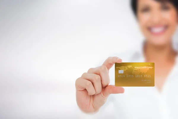 Happy businesswoman showing a creditcard — Stock Photo, Image