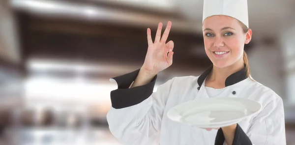 Satisfying chef and holding an empty plate — Stock Photo, Image