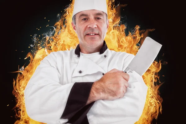 Ritratto di uno chef serio con un coltello in mano — Foto Stock