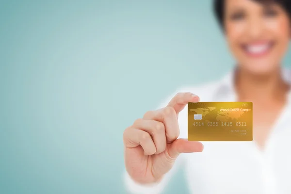 Happy businesswoman showing a creditcard — Stock Photo, Image