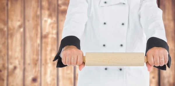 Fechar em cima de um chef segurando um rolo — Fotografia de Stock