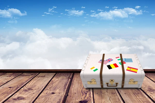 Composite image of suitcase with stickers — Stock Photo, Image