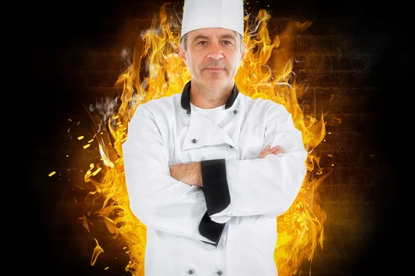 Ernstige chef-kok gekruiste armen — Stockfoto