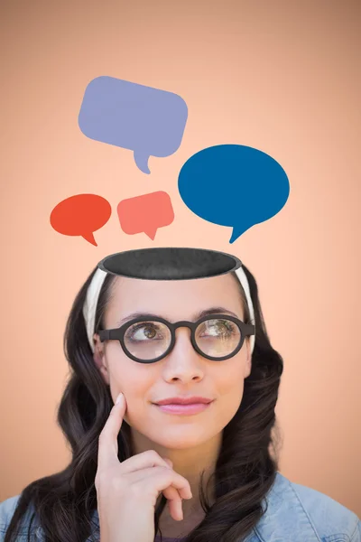 Composite image of thinking brunette — Stock Photo, Image