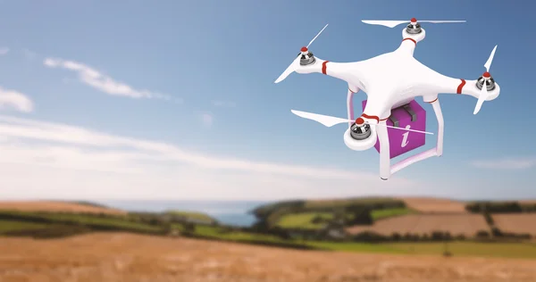Kompositbild einer Drohne, die einen rosa Würfel bringt — Stockfoto