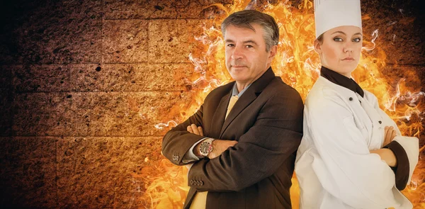 Portrait of chef and businessman back to back — Stock Photo, Image