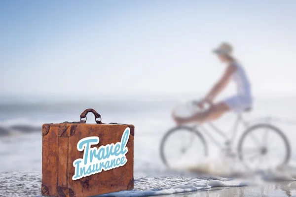 Travel insurance message on an old suitcase — Stock Photo, Image