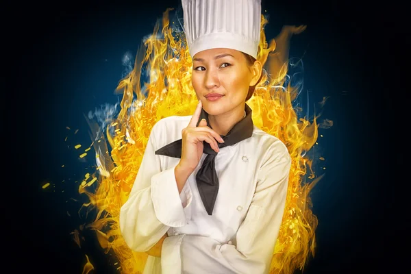 Portrait of thoughtful female cook in kitchen — Stock Photo, Image