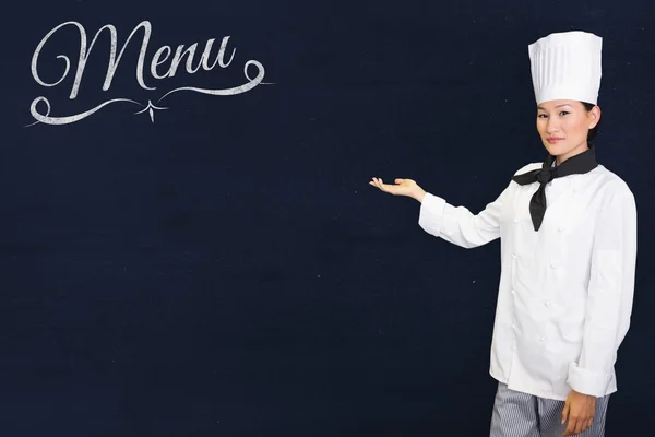 Confident female cook in the kitchen — Stock Photo, Image