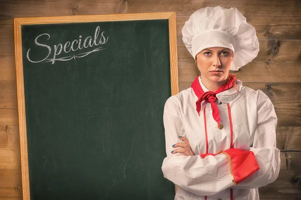 Pretty chef standing with arms crossed — Stock Photo, Image