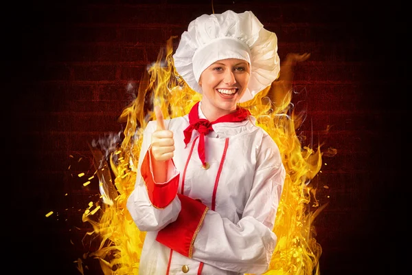 Pretty chef showing thumbs up — Stock Photo, Image