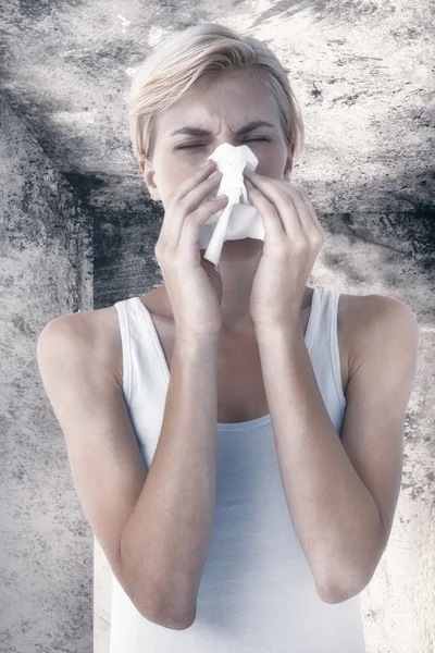 Portrait of woman blowing her nose — Stock Photo, Image