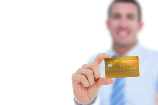 Happy businessman showing a creditcard — Stock Photo, Image