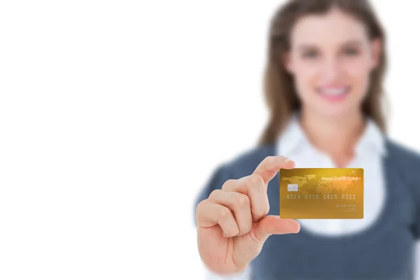 Happy businesswoman showing a creditcard — Stock Photo, Image