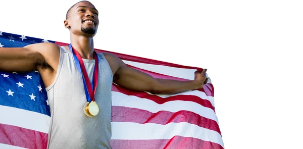 Deportista posando con una bandera americana — Foto de Stock