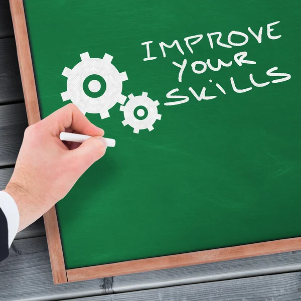 Hand of businessman writing with white chalk — Stock Photo, Image