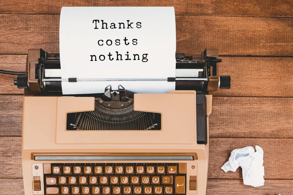 Thanks costs nothing message on typewriter — Stock Photo, Image