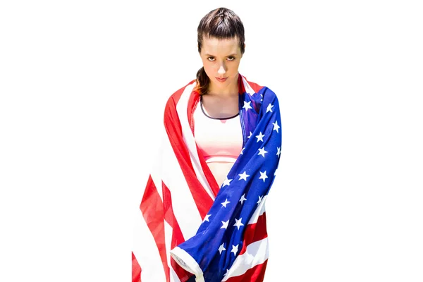 Sporty woman holding American flag — Stock Photo, Image