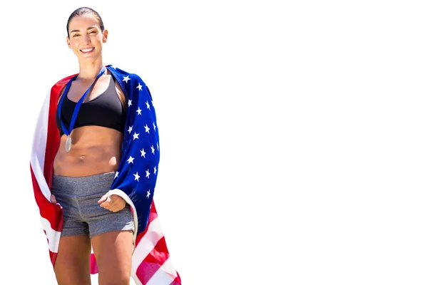 アメリカの国旗を持つスポーティな女性 — ストック写真