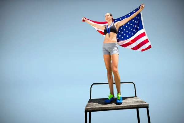 Mujer con bandera americana y medalla —  Fotos de Stock