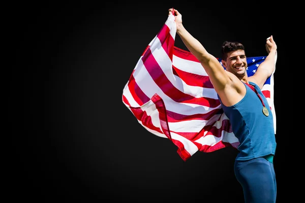 Американский спортсмен побеждает в соревнованиях — стоковое фото