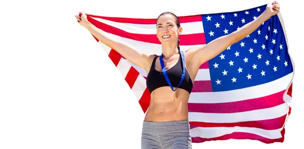 Sportswoman with an american flag — Stock Photo, Image