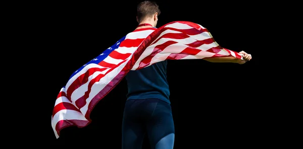 Deportista sosteniendo una bandera americana —  Fotos de Stock