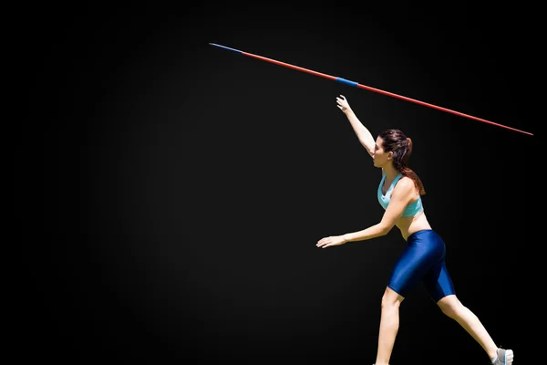 Sportswoman is practicing javelin throw — Stock Photo, Image